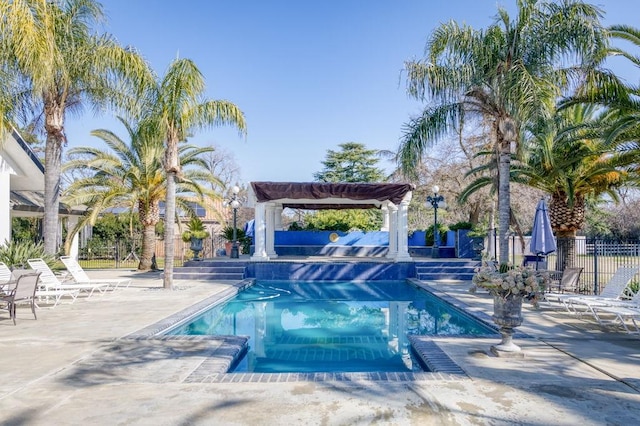 view of swimming pool with a pergola and a patio