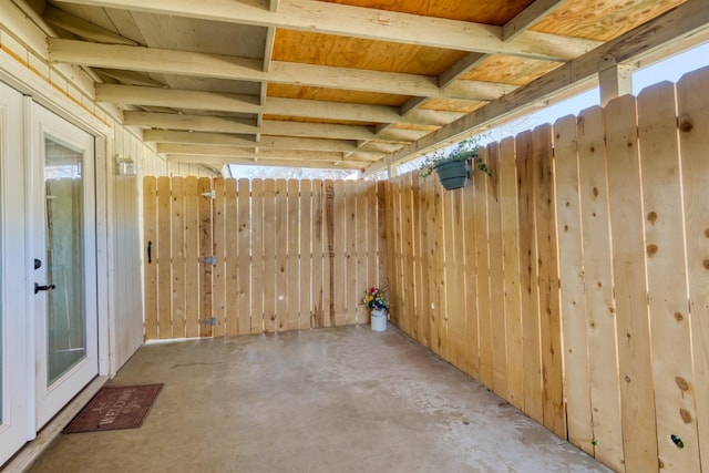 basement featuring wooden walls