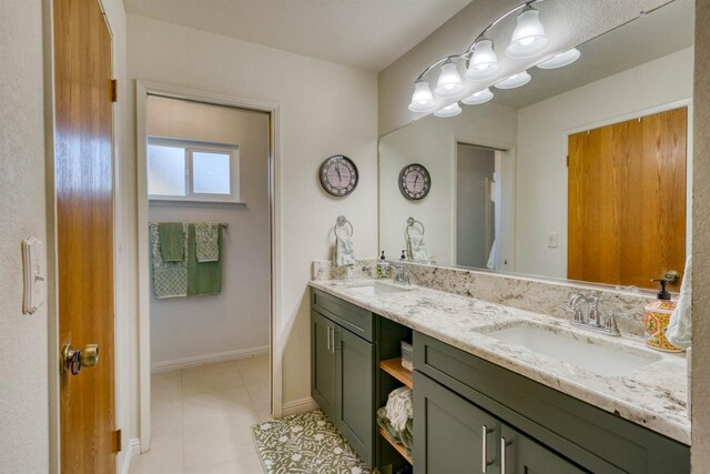 bathroom featuring vanity and tile patterned flooring