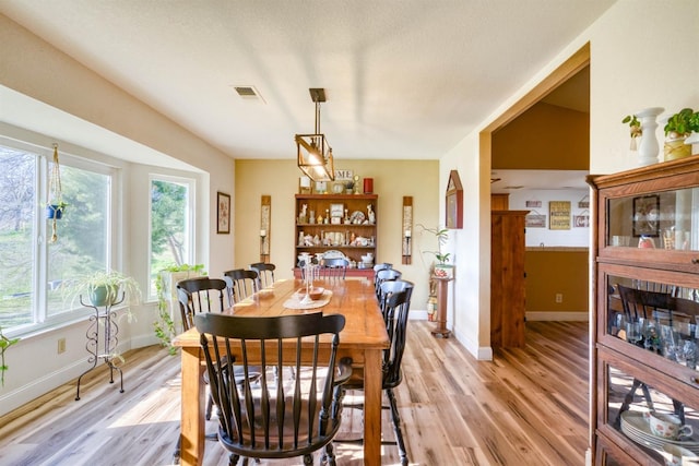 dining room with light wood-type flooring