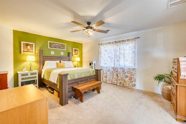 bedroom with light colored carpet and ceiling fan