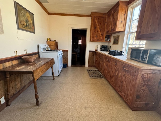 kitchen with white gas range oven