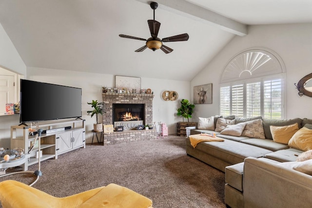 living room featuring lofted ceiling with beams, ceiling fan, a brick fireplace, and carpet flooring