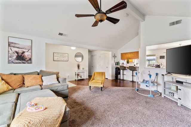 living area with beam ceiling, visible vents, a ceiling fan, and high vaulted ceiling