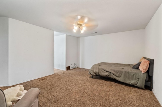 carpeted bedroom featuring visible vents, a ceiling fan, and baseboards