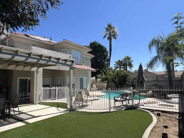 view of pool with a yard, a pergola, and a patio area