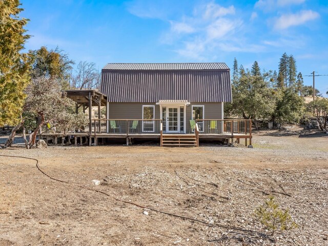 view of front of property featuring a wooden deck and french doors