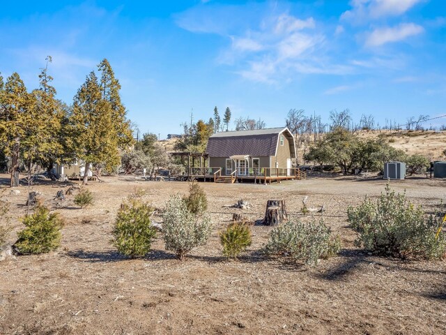 view of yard with a wooden deck