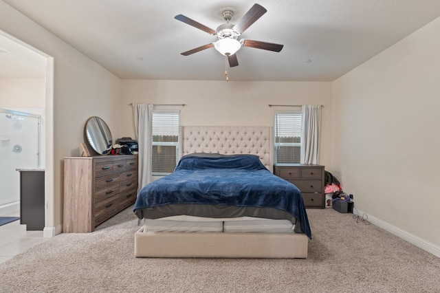 bedroom with ceiling fan and light colored carpet