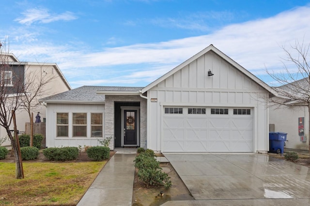 view of front facade with a garage and a front lawn