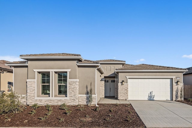 prairie-style house featuring a garage