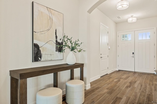 foyer entrance with hardwood / wood-style floors