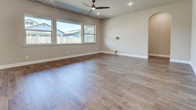 empty room with light hardwood / wood-style flooring and ceiling fan