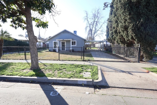 bungalow-style home with a front yard