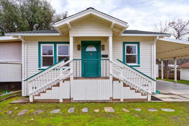 view of front of home with a carport