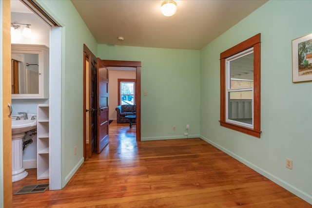 hallway with wood-type flooring