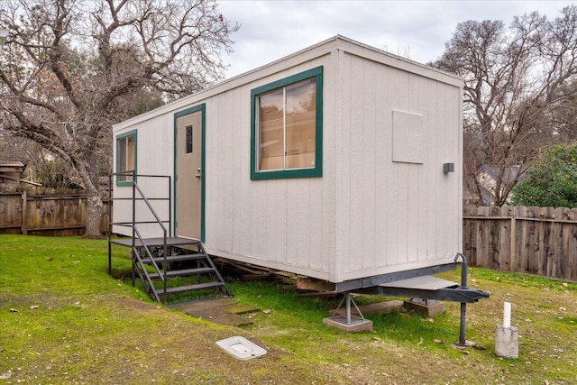 view of outdoor structure with a yard