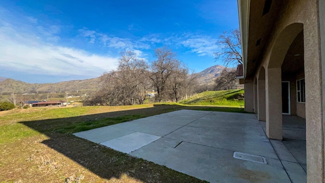 view of patio featuring a mountain view