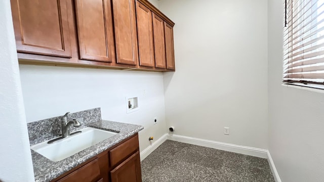 clothes washing area featuring washer hookup, sink, cabinets, and hookup for an electric dryer