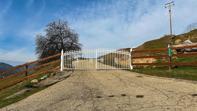 view of gate with a mountain view