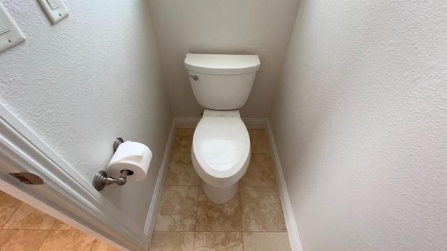 bathroom featuring tile patterned floors and toilet