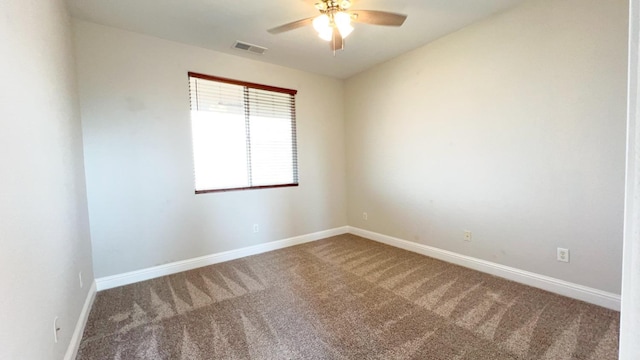 spare room with ceiling fan and carpet flooring