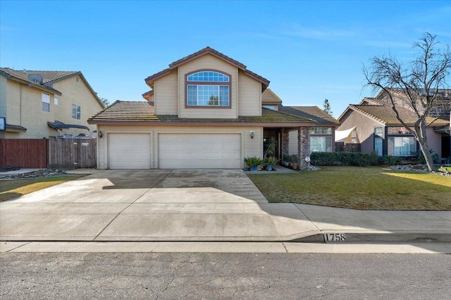 view of front property with a garage and a front yard