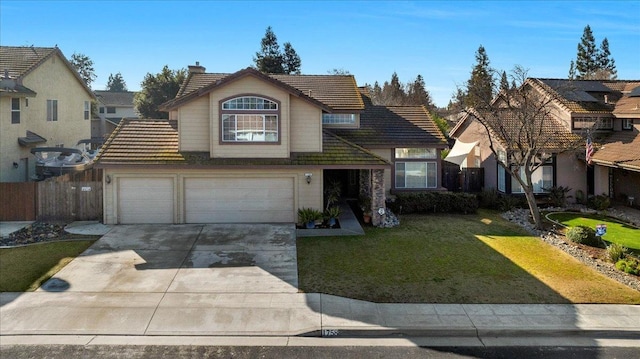 front facade with a garage and a front lawn