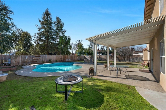 view of swimming pool featuring a yard, a pergola, a patio area, and an outdoor fire pit