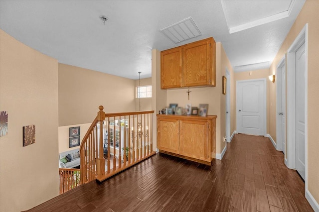 hallway with dark hardwood / wood-style flooring