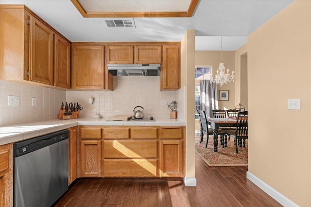 kitchen featuring decorative light fixtures, dark hardwood / wood-style flooring, dishwasher, a notable chandelier, and decorative backsplash