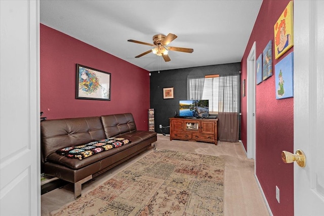 living room with light carpet and ceiling fan