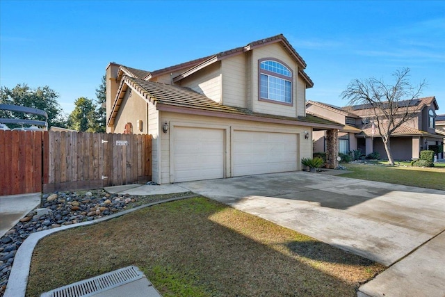 front of property with a garage and a front yard