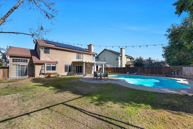 view of pool featuring a pergola, a patio, and a lawn