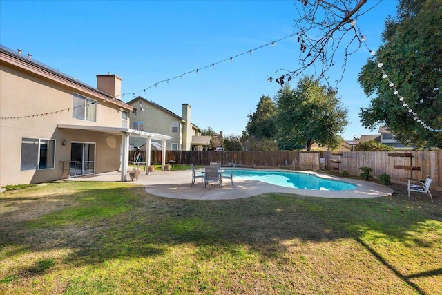 view of pool with a patio, a yard, and a pergola