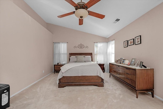 bedroom with light carpet, vaulted ceiling, and ceiling fan