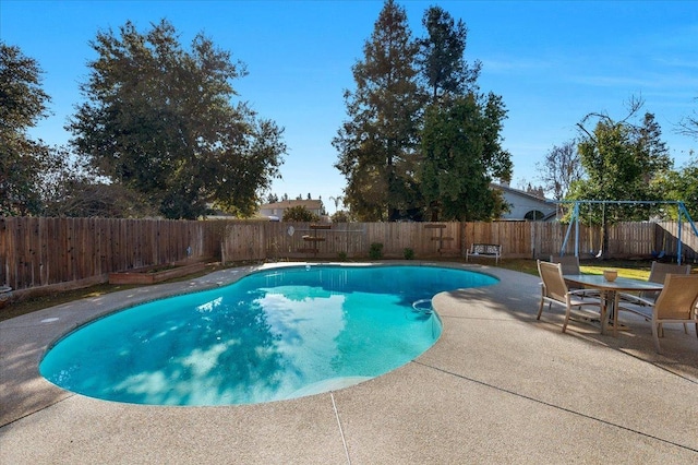 view of swimming pool with a patio