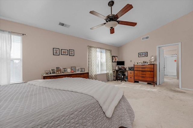 bedroom featuring ceiling fan, light colored carpet, vaulted ceiling, and multiple windows