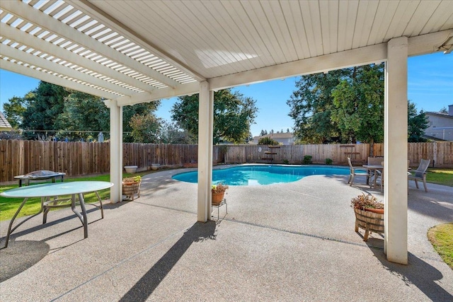 view of swimming pool featuring a patio and a pergola