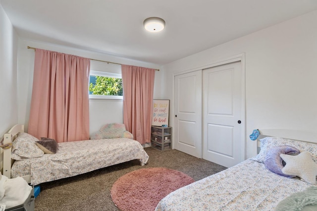 carpeted bedroom with a closet