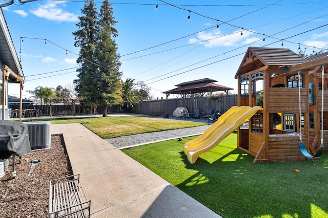 view of jungle gym featuring cooling unit, a yard, and a patio