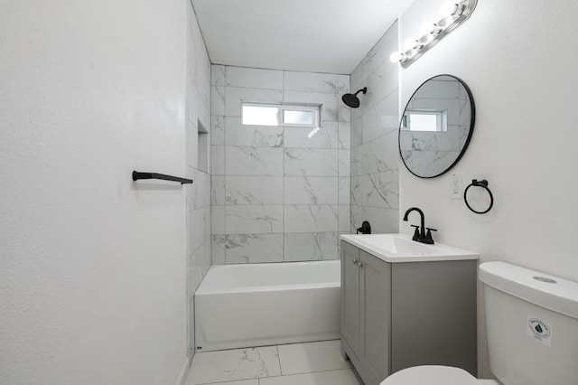 full bathroom with vanity, toilet, and tiled shower / bath combo