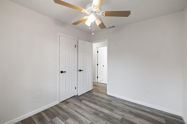 unfurnished bedroom with wood-type flooring and ceiling fan