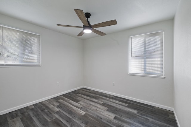 unfurnished room with ceiling fan, a healthy amount of sunlight, and dark hardwood / wood-style flooring