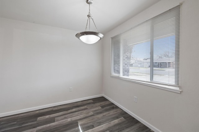 unfurnished room featuring dark hardwood / wood-style floors