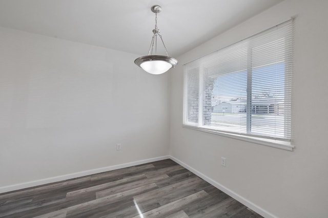 unfurnished room featuring dark wood-type flooring