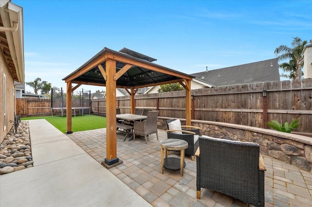 view of patio with a gazebo and a trampoline