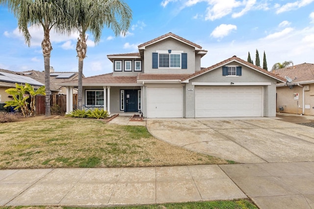 front of property featuring a garage, a front yard, and solar panels