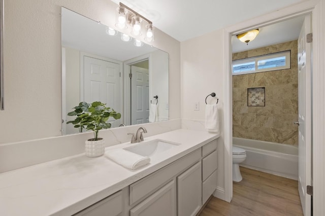 968 E Muncie, Fresno, CA 93720 - full bathroom featuring vanity, toilet,  shower combination, and wood finished floors