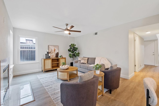 968 E Muncie, Fresno, CA 93720 - living area featuring baseboards, light wood-style flooring, a ceiling fan, and visible vents